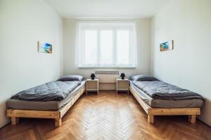 Posteľ alebo postele v izbe v ubytovaní Skodova 4 Apartments