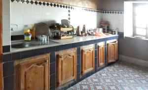 a kitchen with a sink and a counter top at Spacious House in Hassilabied in Hassilabied