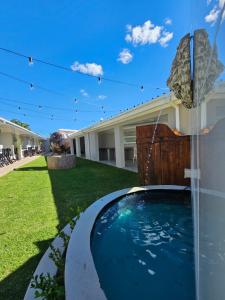 a swimming pool in the backyard of a house at Lion Lodge in Bloemfontein