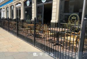 a wrought iron fence in front of a store at The Carmichael - Hull City Centre in Hull