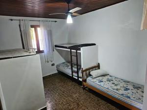 Ένα ή περισσότερα κρεβάτια σε δωμάτιο στο Cantinho Jango