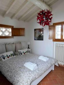 Ένα ή περισσότερα κρεβάτια σε δωμάτιο στο Gigallino in campagna, a due passi da Firenze