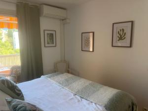 Кровать или кровати в номере Magnifique Appartement à Cassis,Parking,2 pas du Port