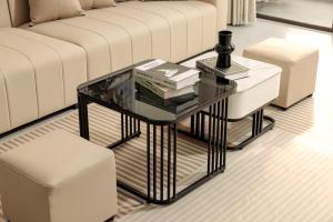a living room with a glass coffee table and a couch at Zen House Ninh Bình in Ninh Binh