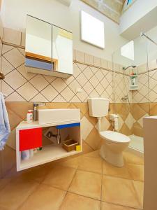 a bathroom with a sink and a toilet at Casa Bauhaus - Design E Comfort A 400 M Dalla Spiaggia Di Pescoluse in Marina di Pescoluse