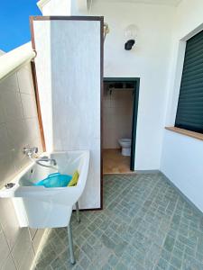 a bathroom with a sink and a toilet at Casa Bauhaus - Design E Comfort A 400 M Dalla Spiaggia Di Pescoluse in Marina di Pescoluse +14 photos