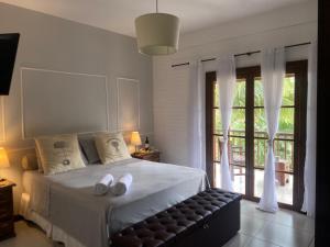 Giường trong phòng chung tại Casa Boutique