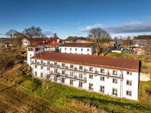 an overhead view of a white building on a hill at Hotel Irschenberg Süd in Irschenberg