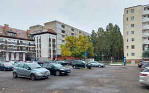 a bunch of cars parked in a parking lot at Central Gallery Apartment in Debrecen