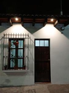 a building with a door and a window at Apartment T46 in Antigua Guatemala +2 photos