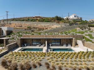 an aerial view of a villa with a swimming pool at Syros Soul Private Pool Suites in Ermoupoli