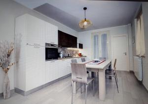 Kuchyň nebo kuchyňský kout v ubytování Casa del Bosco