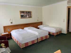 Katil atau katil-katil dalam bilik di Hotel Ochsen Stuttgart