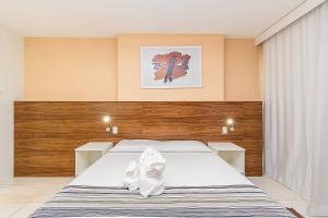 Ένα ή περισσότερα κρεβάτια σε δωμάτιο στο Vision Hotel em Brasília 06908