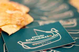 a green book with a picture of a pizza at Barqueiras15 in O Grove