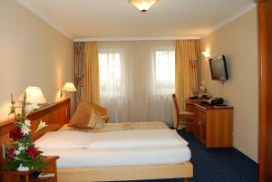 Katil atau katil-katil dalam bilik di Hotel Ochsen Stuttgart
