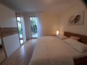 Ένα ή περισσότερα κρεβάτια σε δωμάτιο στο Monte-Noble-II