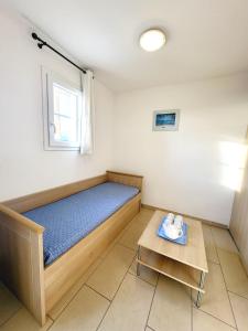 Postel nebo postele na pokoji v ubytování 4-6 couchages vue mer et port de Solenzara Corse