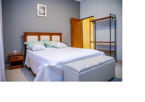 Postel nebo postele na pokoji v ubytování Bujumbura Hotel and Appartment