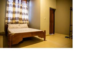 Postel nebo postele na pokoji v ubytování Bujumbura Hotel and Appartment