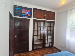 Televisyen dan/atau pusat hiburan di Casa Azul - Quitandinha