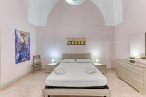 Postel nebo postele na pokoji v ubytování Palazzo Rondine - Affittacamere con cucina