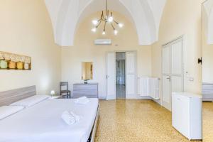 Postel nebo postele na pokoji v ubytování Palazzo Rondine - Affittacamere con cucina