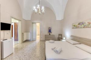 TV a/nebo společenská místnost v ubytování Palazzo Rondine - Affittacamere con cucina