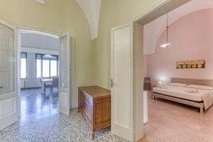 Postel nebo postele na pokoji v ubytování Palazzo Rondine - Affittacamere con cucina