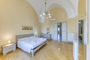 Postel nebo postele na pokoji v ubytování Palazzo Rondine - Affittacamere con cucina