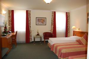 Katil atau katil-katil dalam bilik di Hotel Ochsen Stuttgart