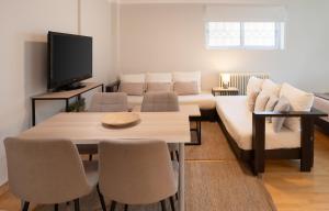 A television and/or entertainment centre at Bright, Cosy Studio close to Glyfada Beach & Center