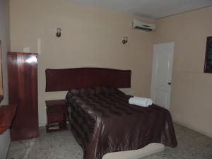 Hacienda Cañada Rica 2 tesisinde bir odada yatak veya yataklar