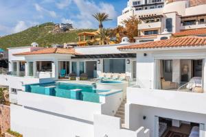 an image of a house with a swimming pool at Villa Esencia Del Mar in Cabo San Lucas