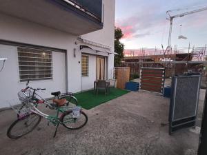 a bike parked outside of a house with a yard at Divine apartment- Schiavonea in Schiavonea