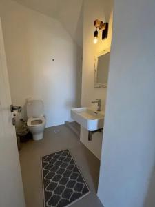 a bathroom with a sink and a toilet at Comfortable apartment with sea view in Antiparos, 77 m² in Andiparos