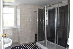 a shower with a glass door in a bathroom at Country House La Feronnière in Le Mesnil-Amand +16 photos