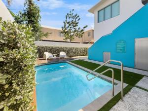 a swimming pool in the backyard of a house at Aquabella 6 Tropical Escape in Isla Verde in San Juan +17 photos
