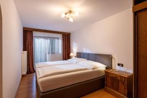 A bed or beds in a room at Appartement Erler