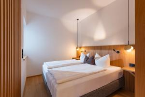 A bed or beds in a room at Appartement Erler