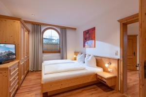A bed or beds in a room at Appartement Erler