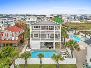 an aerial view of a house with a pool at Experience luxury at On The Rocks, spacious 4 bedroom retreat with private pool! in Ocean Isle Beach