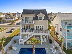 an aerial view of a house with a pool at Experience luxury at Notorious OIB, a spacious 4 bedrooms, 4 baths, perfect for up to 10 guests in Ocean Isle Beach