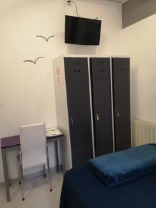 Postel nebo postele na pokoji v ubytování Hostel de las Facultades