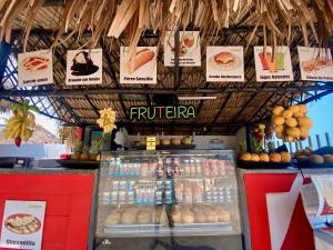 a fast food restaurant with a display of food at Hotel Playa Blanca - San Antero in San Antero