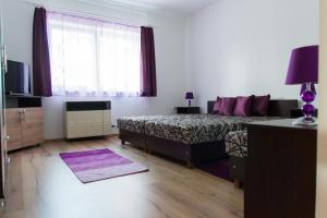 Postel nebo postele na pokoji v ubytování Levendula Vendégház