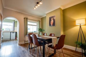 a dining room with a table and chairs at Host & Stay - Mayfield House in Ashbourne +18 photos