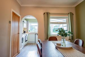 a kitchen and dining room with a table and a window at Host & Stay - Mayfield House in Ashbourne