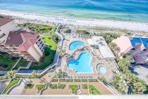 an aerial view of a resort with a pool and the beach at TOPS'L Tides 0207 in Destin