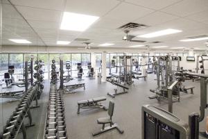 a gym with rows of treadmills and machines at TOPS'L Tides 0207 in Destin